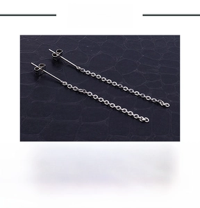 Detail of stainless steel tassel earring chain in steel color weighing 1g on black background