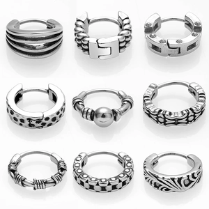 Collection of vintage silver steel hoop earrings with punk and gothic textured patterns