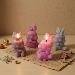 Set of four cute sitting rabbit candles in assorted colors for Easter DIY decoration
