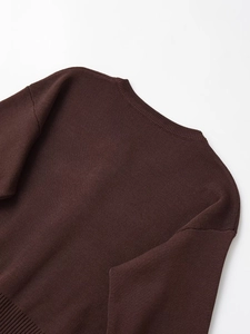 Detail of ribbed crew neck and high-density knit fabric on dark coffee long sleeve sweater