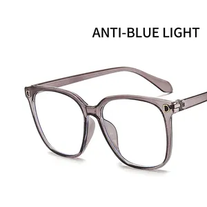 Large square anti-blue light glasses with transparent grey purple frames and D-letter detail