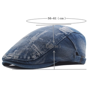 Denim beret cap in washed blue with tassel fringe and adjustable metal buckle strap