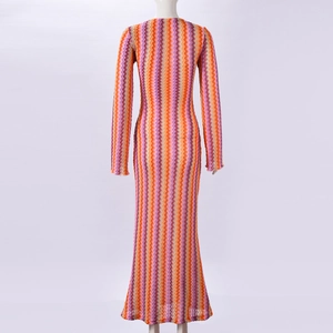 Macro shot showing the colorful zigzag wave pattern and fine knit texture of the dress