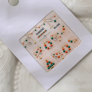 Christmas 2025 nail art stickers with K9 rhinestones and metallic tree decorations