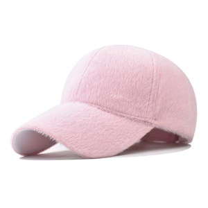 Detail of soft pink faux rabbit fur texture on a warm winter baseball cap for women