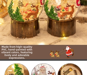 Macro d'un Père Noël et renne peints à la main dans une boule à neige de Noël en PVC