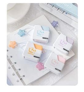 Mini portable staplers in pastel blue, orange, purple and pink with star pendants