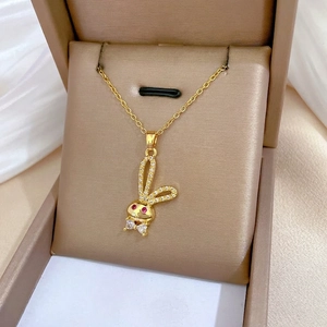 Elegant gold-tone rabbit necklace with sparkling zircon pavé and red eyes in a gift box