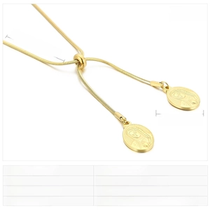 Macro view of gold stainless steel religious pendant necklaces with adjustable snake chain