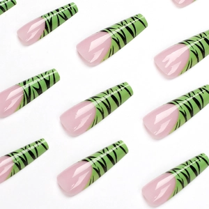 Long coffin false nails featuring light pink base and glossy green tiger stripe patterns