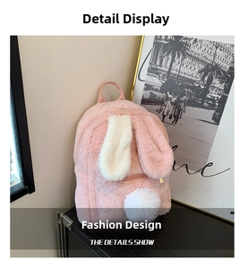 Close-up of pink faux fur backpack with cute long bunny ears and white pom pom detail