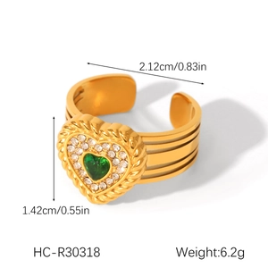 Detail view of heart-shaped green zircon ring with dimensions and layered gold band