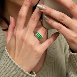 Sparkling rectangle green zircon ring in 18K gold plated finish worn by a model