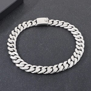 Close-up of 24mm silver Cuban chain link necklace with square buckle on black background