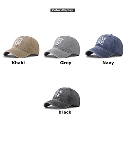 Detailed close-up of four washed cotton baseball caps in khaki, grey, navy, and black colors