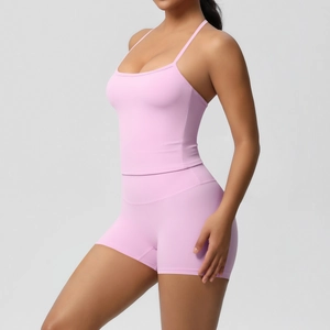 Detailed view of pink yoga set showing slimming camisole and high-waist sports shorts