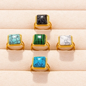 Set of five gold stainless steel rings with square colorful stones in malachite and marble