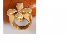 Polished 18k gold plated stainless steel ring featuring a 3D floral clover design