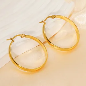 Elegant gold round hoop earrings with polished finish on a luxury satin background