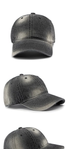 Detailed view of washed denim texture and distressed finish on the vintage baseball cap