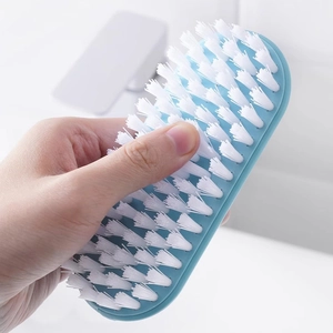 Blue plastic floor brush with thick white bristles for bathroom tile and tub cleaning