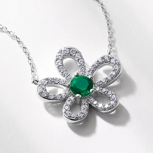 Elegant S925 silver flower necklace with emerald center stone and sparkling diamonds
