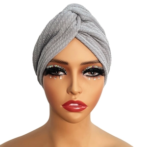 Close-up of the light gray twisted knit texture on this elastic turban headwrap for women