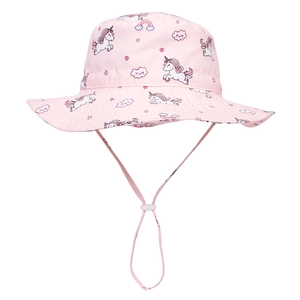 Close-up of pink sun hat featuring unicorn rainbow prints and adjustable chin strap