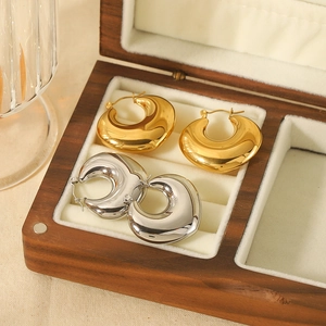 Polished heart-shaped hollow hoop earrings in gold and silver finish for women