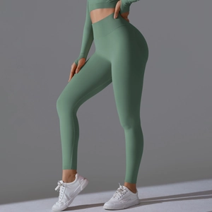 Detail of pea green seamless yoga set with thumb holes and high waist leggings