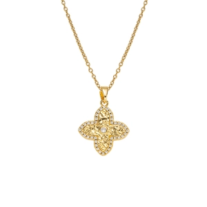 Luxurious gold clover pendant necklace with hammered texture and white crystal accents
