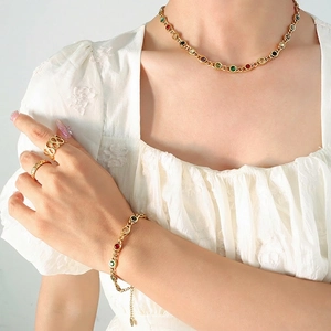 Bohemian gold jewelry set with colorful zircons including necklace, bracelet and rings