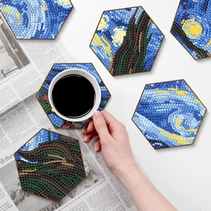Detail of DIY diamond painting coaster with Starry Night design and a white coffee cup