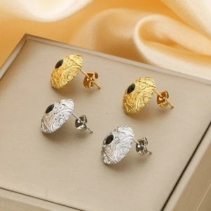 French cloud pattern 18k gold and silver dome earrings with black onyx inlay