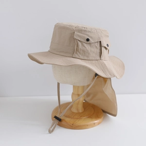 Detail of khaki outdoor sun hat featuring tactical snap pocket and adjustable wind cord