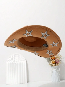 Detail of a brown cowboy hat with silver sequin stars and polyester-cotton fabric texture