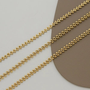 Detailed view of 18K gold plated wheat ear and geometric box chain necklaces