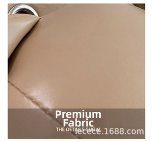 Detailed close-up of beige PU leather texture with precision stitching and metal eyelet