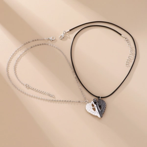 Magnetic angel wing heart necklaces for couples with silver and black metal pendants
