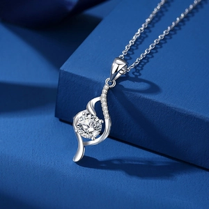 Elegant S925 sterling silver necklace with 1.25 carat moissanite pendant on blue background