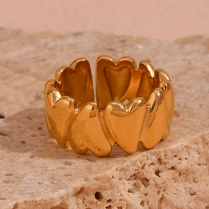 Artistic 18K gold-plated stainless steel ring with linked hearts on a textured stone