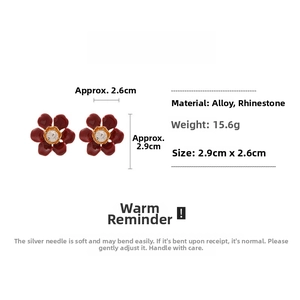 Detailed view of Ancora red flower earrings with crystal center and size specifications