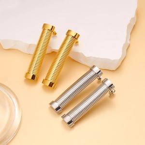 Fashionable threaded cylinder earrings in gold and silver stainless steel finish