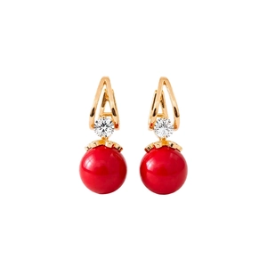 Elegant gold drop earrings with zircon crystals and large red round beads on white background