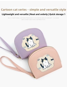 Close-up of cute cat cartoon wallets in pink and purple PU leather with wrist straps