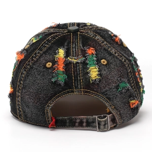 Washed dark grey distressed denim baseball cap with colorful frayed holes and metal buckle