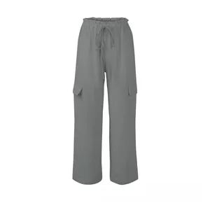 Detail of grey cotton linen cargo pants with drawstring waist and flap pockets