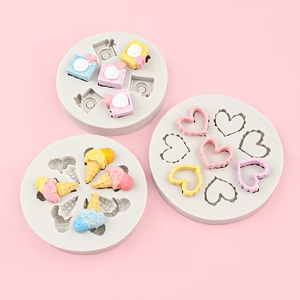 Silicone mold set featuring cartoon camera heart and ice cream cone shapes for DIY crafts