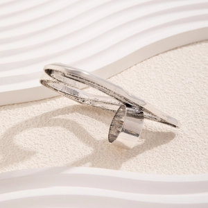 Close-up of vintage silver wide band ring featuring an irregular rectangular flat surface