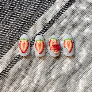 Detail of 3D embossed strawberry nail stickers with realistic water drop texture